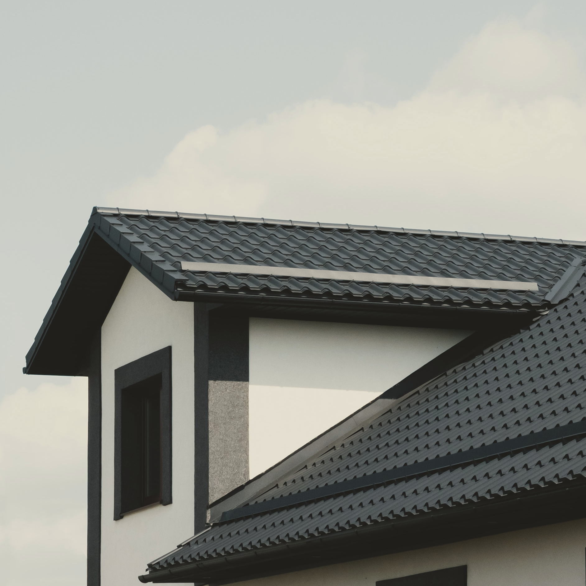 A close-up view of a black colored roof of a house.